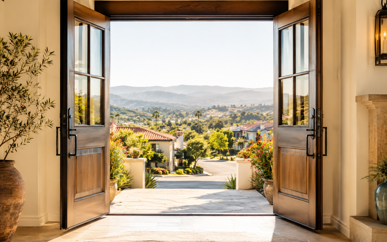 Open double doors looking toward a beautiful SoCal neighborhood